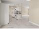 Open Kitchen concept with white appliances, lots of light, and sleek floors at 13102 Se 101St Ave, Belleview, FL 34420