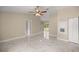 Spacious living room with light, neutral walls, white trim, and sleek floors at 13102 Se 101St Ave, Belleview, FL 34420
