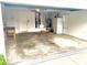 Spacious two car garage with a work bench, and white refrigerator at 1402 Arredondo Dr, The Villages, FL 32162