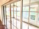 Enclosed sun room with multiple windows allowing for plentiful natural light at 1402 Arredondo Dr, The Villages, FL 32162