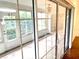 Sun room showcasing outdoor views through large glass windows at 1402 Arredondo Dr, The Villages, FL 32162
