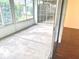 Enclosed sunroom with access to the house and the backyard at 1402 Arredondo Dr, The Villages, FL 32162