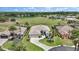 Beautiful single-story home with a well-manicured lawn, lush landscaping, and an oversized driveway at 1427 Sw 161St St, Ocala, FL 34473