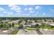 Neighborhood aerial view of single-story homes with manicured lawns and lush landscaping, interspersed with palm trees at 1427 Sw 161St St, Ocala, FL 34473