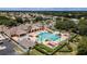 Aerial view of large community pool with lounge seating, mature landscaping, and beautiful neighborhood at 1427 Sw 161St St, Ocala, FL 34473