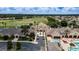 A beautiful aerial view of the community center and amenities including a pool, golf course and parking at 1427 Sw 161St St, Ocala, FL 34473