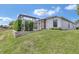 Backyard with covered lanai and green grass at 1427 Sw 161St St, Ocala, FL 34473