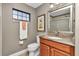Bathroom with a tile floor, glass-doored shower and a granite-topped vanity at 1427 Sw 161St St, Ocala, FL 34473