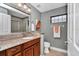 Bathroom featuring granite countertops, stylish fixtures, and a shower at 1427 Sw 161St St, Ocala, FL 34473