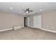 Large bedroom featuring carpet floors, ceiling fan, and natural light at 1427 Sw 161St St, Ocala, FL 34473