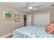 Comfortable bedroom with a ceiling fan, closet, and decorative wall art at 1427 Sw 161St St, Ocala, FL 34473