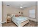 Cozy bedroom is well lit and has a ceiling fan and hardwood floors at 1427 Sw 161St St, Ocala, FL 34473