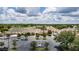 Aerial view of the community center with a parking lot and landscape that has green spaces and parking spots at 1427 Sw 161St St, Ocala, FL 34473