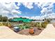 Community garden with various plants, shaded netting, and lush foliage at 1427 Sw 161St St, Ocala, FL 34473