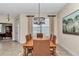 Formal dining room featuring decorative lighting fixture and seating for six at 1427 Sw 161St St, Ocala, FL 34473