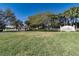 SummerGlen's inviting entrance boasts a lush green lawn, beautiful sign, and glimpses of the gated community at 1427 Sw 161St St, Ocala, FL 34473