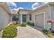 Inviting front entrance with a well-maintained garden, charming fountain, and bright blue door at 1427 Sw 161St St, Ocala, FL 34473