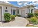Inviting front entrance with well-maintained landscaping and a lovely blue front door at 1427 Sw 161St St, Ocala, FL 34473