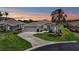 Beautiful single-story home with a well-manicured lawn, lush landscaping, and a two-car garage at 1427 Sw 161St St, Ocala, FL 34473