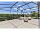 Open lanai with seating and sunny sky at 1427 Sw 161St St, Ocala, FL 34473