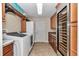 Spacious laundry room features large capacity washer and dryer and wine cooler at 1427 Sw 161St St, Ocala, FL 34473