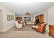 Open-concept living area flows to the kitchen, featuring comfortable seating and natural light for easy living and entertaining at 1427 Sw 161St St, Ocala, FL 34473