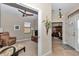 Cozy living room leads to the home office and features a recliner, ceiling fan, and doorway to front of the home at 1427 Sw 161St St, Ocala, FL 34473