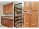 Butlers pantry features wine cooler and custom cabinets and granite counter tops at 1427 Sw 161St St, Ocala, FL 34473