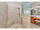 Walk-in shower with tiled walls and floors, a built-in seat, and glass partition at 1427 Sw 161St St, Ocala, FL 34473