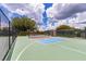 Well-maintained and fenced tennis and pickleball court with a storage shed at 1427 Sw 161St St, Ocala, FL 34473