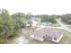 Aerial view of home, lush trees, and a residential area showcasing the peaceful setting at 15011 Sw 61St Court Rd, Ocala, FL 34473