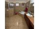 Well-appointed bathroom featuring a separate shower, tub, and tile surround at 15011 Sw 61St Court Rd, Ocala, FL 34473