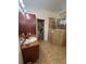 Well-lit bathroom featuring a walk-in shower with glass door and a single vanity at 15011 Sw 61St Court Rd, Ocala, FL 34473