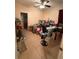 Cluttered bedroom space offering a view of a desk, boxes, fan, and ironing board at 15011 Sw 61St Court Rd, Ocala, FL 34473