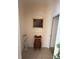Hallway showcasing art and decor, with tiled flooring and neutral wall colors at 15011 Sw 61St Court Rd, Ocala, FL 34473