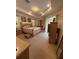 Bright and airy main bedroom with tray ceiling, carpet, and windows with blinds at 15011 Sw 61St Court Rd, Ocala, FL 34473