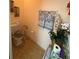 Cozy powder room featuring a comfort-height toilet with neutral decor at 15011 Sw 61St Court Rd, Ocala, FL 34473