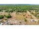 High-angle shot of land highlighting a dwelling and adjacent open land, conveying the property's serene and pastoral ambiance at 15465 Se 113Th Street Rd, Ocklawaha, FL 32179