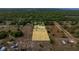 High-angle shot of land highlighting a dwelling and adjacent open land, conveying the property's serene and pastoral ambiance at 15465 Se 113Th Street Rd, Ocklawaha, FL 32179