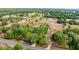 Expansive aerial view of a rural property featuring lush greenery and several structures in a serene countryside setting at 15465 Se 113Th Street Rd, Ocklawaha, FL 32179