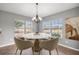 Dining room with chandelier and lots of natural light at 15465 Se 113Th Street Rd, Ocklawaha, FL 32179