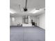 Spacious garage with storage, sink, and access doors at 15465 Se 113Th Street Rd, Ocklawaha, FL 32179