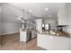 Kitchen area featuring stainless steel dishwasher and appliances, with breakfast bar area at 15465 Se 113Th Street Rd, Ocklawaha, FL 32179