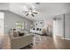 An open-concept living room with tile floors, neutral colors, a ceiling fan, and recessed lighting at 15465 Se 113Th Street Rd, Ocklawaha, FL 32179