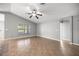 Spacious living room with tile floors, neutral gray walls, a ceiling fan, and recessed lighting at 15465 Se 113Th Street Rd, Ocklawaha, FL 32179