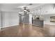 Open floorplan with breakfast bar, ceiling fan, recessed lights, and tile floors that transition to the kitchen at 15465 Se 113Th Street Rd, Ocklawaha, FL 32179