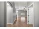 An open-concept home showcasing ceramic tile floors, modern archways, and large windows at 15465 Se 113Th Street Rd, Ocklawaha, FL 32179