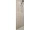 Updated shower with tiled walls, and modern shower head at 15465 Se 113Th Street Rd, Ocklawaha, FL 32179