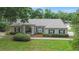 Charming single-story home with manicured lawn, mature landscaping, and elegant front entry at 1617 Se 29Th Ter, Ocala, FL 34471