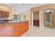Gourmet kitchen with breakfast bar and access to the living areas at 1617 Se 29Th Ter, Ocala, FL 34471